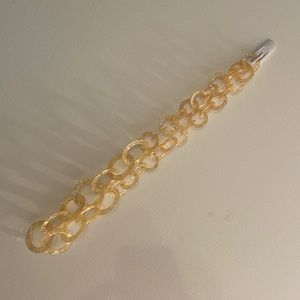 Vintage necklace. Circle design made of rose colored plastic.